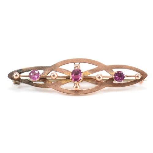 251 - An early 20th Century antique 9ct gold and pink stone brooch. The brooch of navette form set with th... 