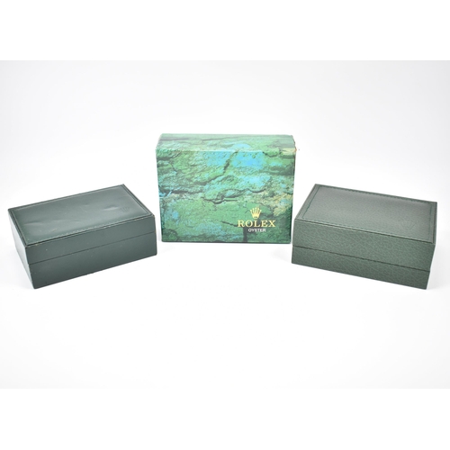 254 - Two vintage Rolex boxes. The box having a green leather exterior with wooden lining, tooled gilt let... 