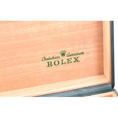 254 - Two vintage Rolex boxes. The box having a green leather exterior with wooden lining, tooled gilt let... 