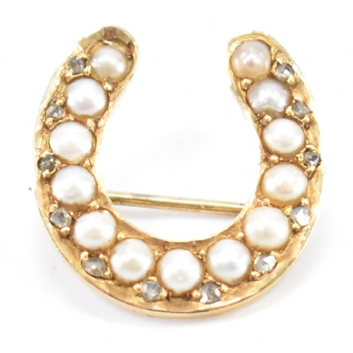 255 - A 19th Century Victorian half pearl and diamond horse shoe brooch. The brooch having a hinge pin to ... 