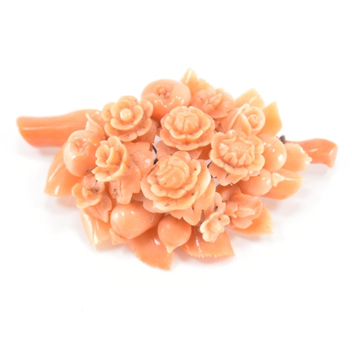 256 - A 19th Century Victorian carved coral brooch. The brooch constructed from a cluster of carved flower... 