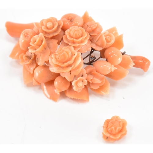 256 - A 19th Century Victorian carved coral brooch. The brooch constructed from a cluster of carved flower... 