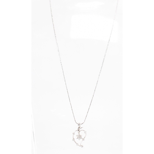 260a - A 18ct white gold and diamond pendant necklace. The necklace having a fine snake chain necklace with... 