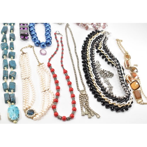 280a - A collection of vintage costume jewellery. The lot to include a scarab beetle necklace, baroque pear... 