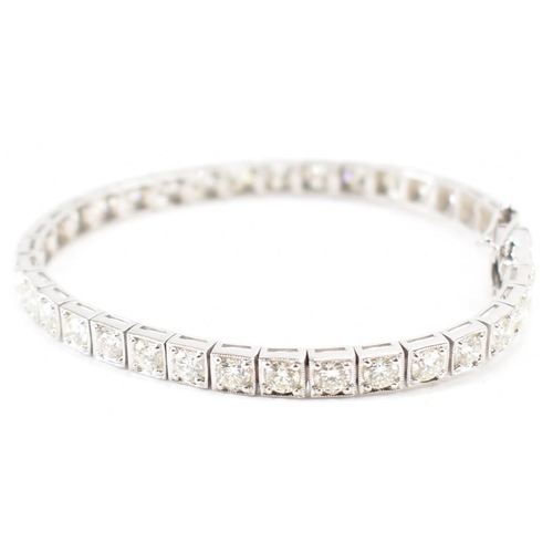 280 - An 18ct white gold and diamond tennis bracelet. The bracelet set with 36 round brilliant cut diamond... 