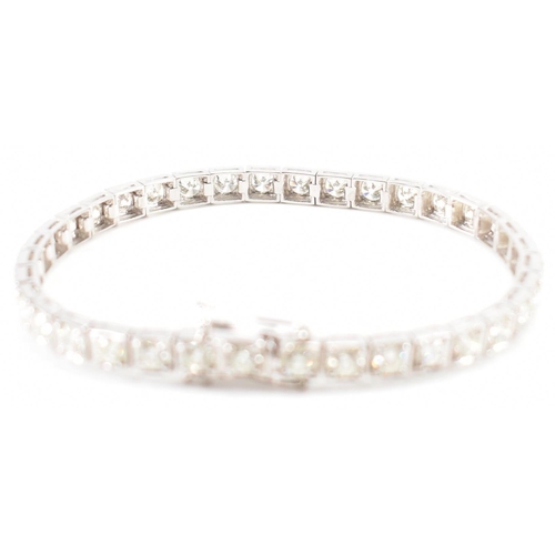 280 - An 18ct white gold and diamond tennis bracelet. The bracelet set with 36 round brilliant cut diamond... 