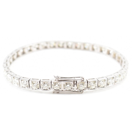 280 - An 18ct white gold and diamond tennis bracelet. The bracelet set with 36 round brilliant cut diamond... 