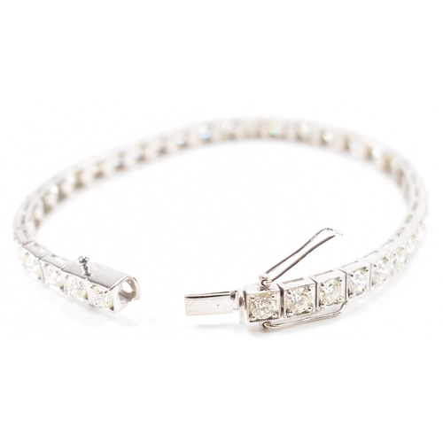 280 - An 18ct white gold and diamond tennis bracelet. The bracelet set with 36 round brilliant cut diamond... 