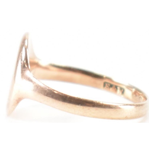 283 - A 9ct gold signet ring. The ring having a blank oval cartouche to plain band. Hallmarks worn and not... 