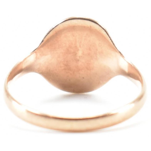 283 - A 9ct gold signet ring. The ring having a blank oval cartouche to plain band. Hallmarks worn and not... 