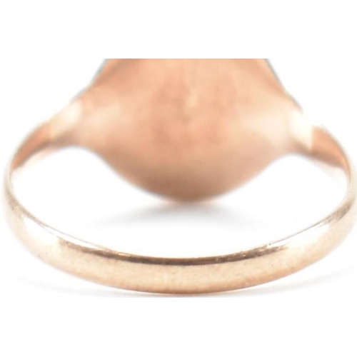 283 - A 9ct gold signet ring. The ring having a blank oval cartouche to plain band. Hallmarks worn and not... 