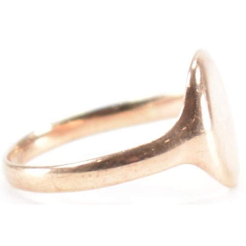 283 - A 9ct gold signet ring. The ring having a blank oval cartouche to plain band. Hallmarks worn and not... 