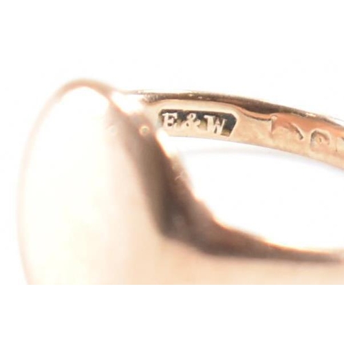 283 - A 9ct gold signet ring. The ring having a blank oval cartouche to plain band. Hallmarks worn and not... 