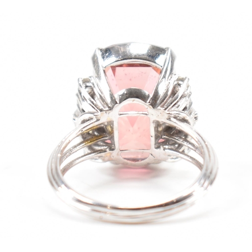 290 - A white gold tourmaline and diamond cocktail ring. The ring set with a pinkish brown tourmaline flan... 