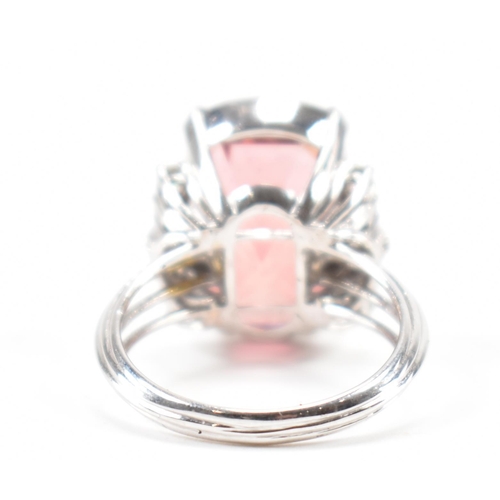 290 - A white gold tourmaline and diamond cocktail ring. The ring set with a pinkish brown tourmaline flan... 