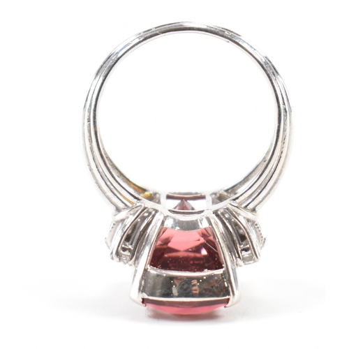 290 - A white gold tourmaline and diamond cocktail ring. The ring set with a pinkish brown tourmaline flan... 