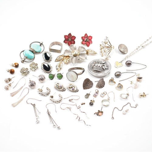 531 - A collection of silver and white metal earrings and brooches. The lot to include a Victorian mournin... 