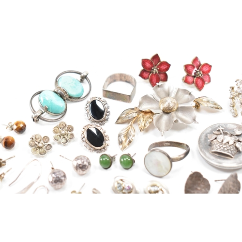 531 - A collection of silver and white metal earrings and brooches. The lot to include a Victorian mournin... 