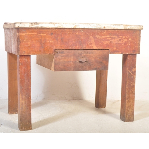 1151 - A mid 20th Century oak and pine works table / bench / butchers block stand. Having a planked top in ... 