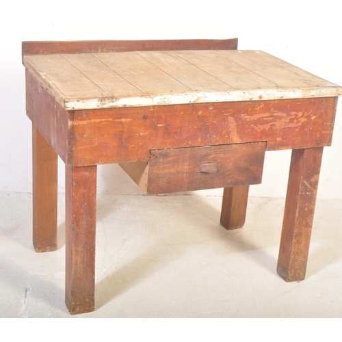 1151 - A mid 20th Century oak and pine works table / bench / butchers block stand. Having a planked top in ... 