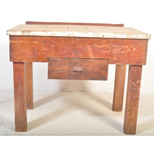 1151 - A mid 20th Century oak and pine works table / bench / butchers block stand. Having a planked top in ... 