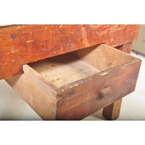 1151 - A mid 20th Century oak and pine works table / bench / butchers block stand. Having a planked top in ... 