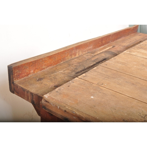 1151 - A mid 20th Century oak and pine works table / bench / butchers block stand. Having a planked top in ... 