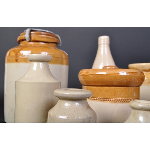 1157a - A collection of vintage 20th Century two tone stoneware lidded jars and bottles. Some white vase / b... 