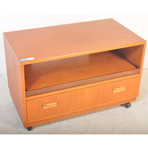 1157 - A vintage retro 1970's G Plan teak wood TV / entertainment unit having a central unit above over a s... 