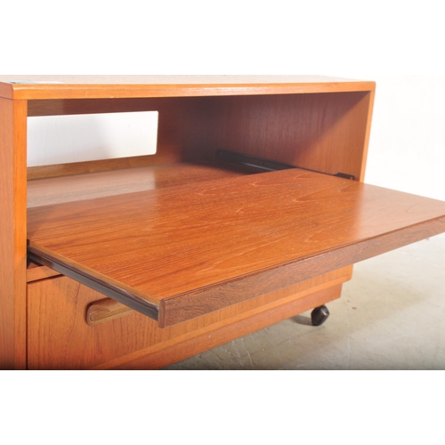 1157 - A vintage retro 1970's G Plan teak wood TV / entertainment unit having a central unit above over a s... 