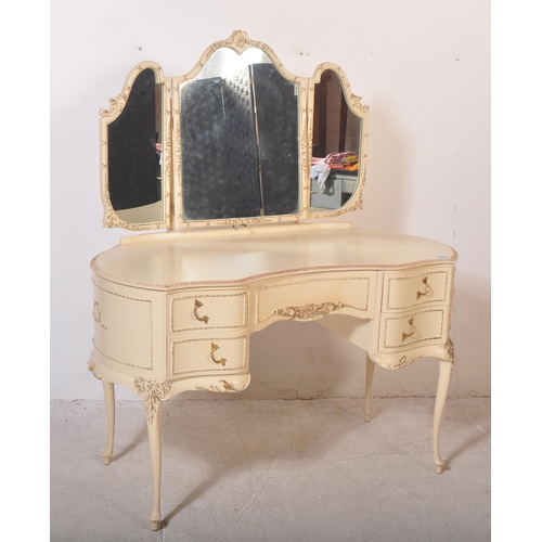 1159 - A 20th century Louis XV style painted dressing table having a glass top with moulded detailing on ed... 