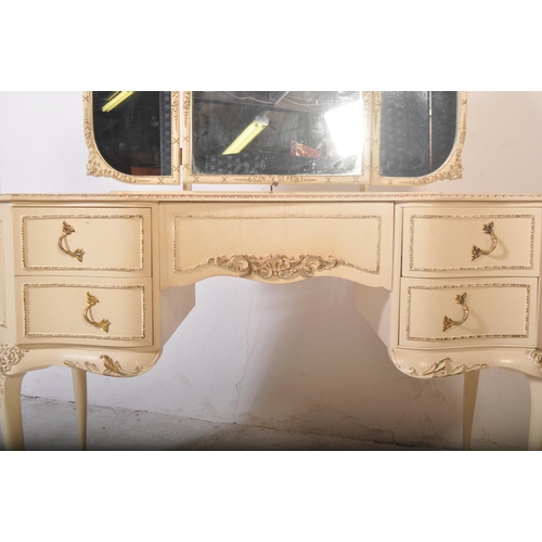 1159 - A 20th century Louis XV style painted dressing table having a glass top with moulded detailing on ed... 