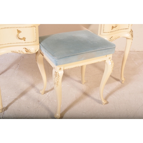 1159 - A 20th century Louis XV style painted dressing table having a glass top with moulded detailing on ed... 