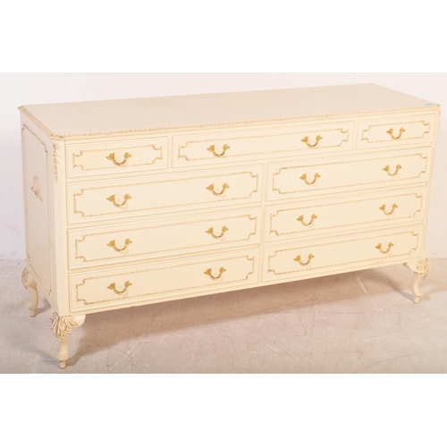 1160 - A 20th century Louis XV style painted sideboard credenza. The chest of drawers having a glass top wi... 