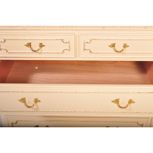 1160 - A 20th century Louis XV style painted sideboard credenza. The chest of drawers having a glass top wi... 