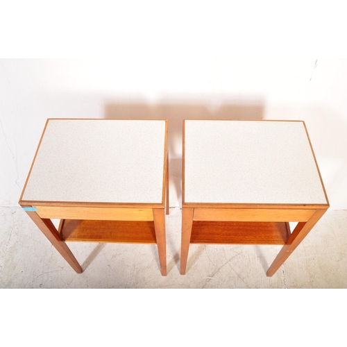 1161a - A pair of vintage mid 20th Century air ministry bedside tables. The tables having formica tops raise... 