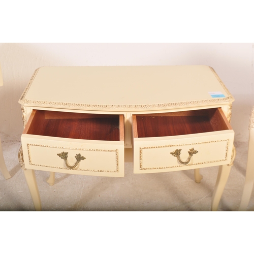 1164 - A pair of 20th century Louis XV style cream painted bedside tables. The pair of bedside cabinets hav... 