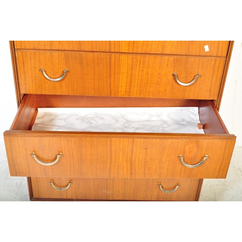 1167A - A vintage retro mid 20th Century Meredew chest of drawers. The chest having a bank of four drawers h... 