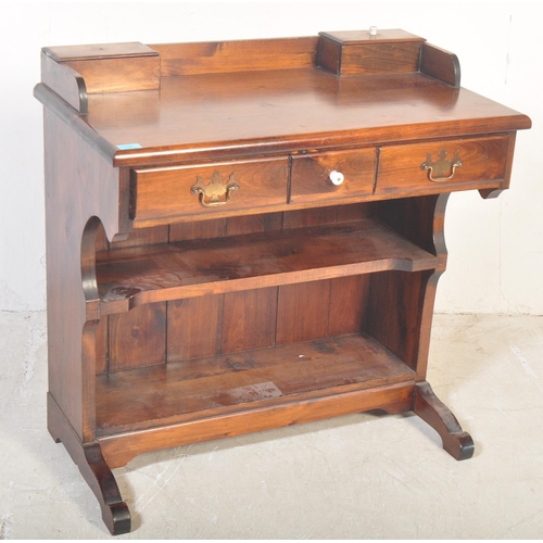 1169 - A vintage 20th century country pine revival writing table desk. Single drawer to the frieze, over op... 