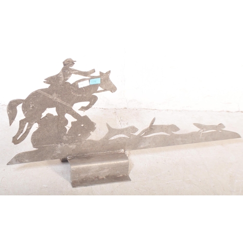 1170 - A 20th century sheet metal Art Deco style roof pediment / sign in the shape of hunting dogs & rider.... 