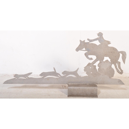 1170 - A 20th century sheet metal Art Deco style roof pediment / sign in the shape of hunting dogs & rider.... 