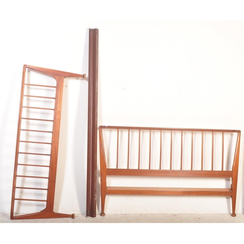 1173 - A 1960's mid century teak double bed frame by Loughborough Furniture and retailed by Heals, London. ... 