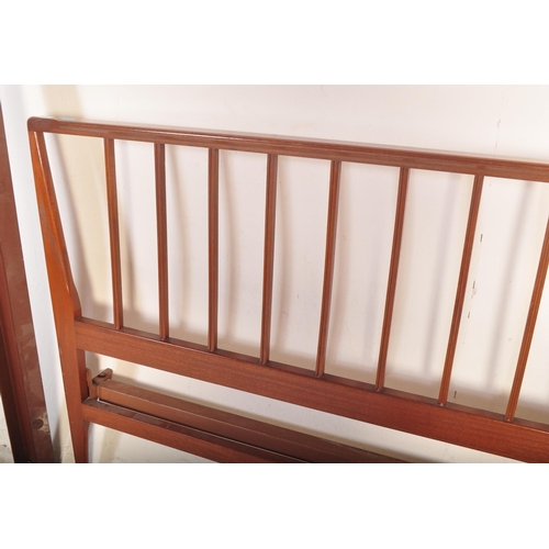 1173 - A 1960's mid century teak double bed frame by Loughborough Furniture and retailed by Heals, London. ... 