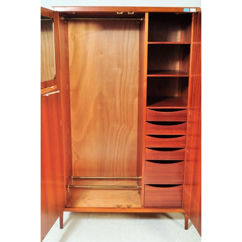 1174 - A 1960's mid century teak pair of wardrobes by Loughborough Furniture and retailed by Heals, London.... 