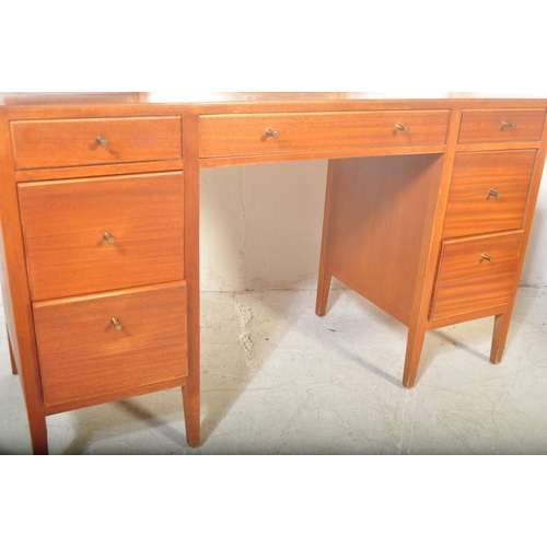 1175 - A 1960's mid century teak dressing table by Loughborough Furniture and retailed by Heals, London. Th... 