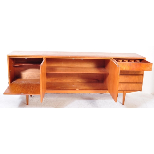 1177A - A vintage mid 20th Century teak wood side board. The sideboard having a central pair of sliding door... 