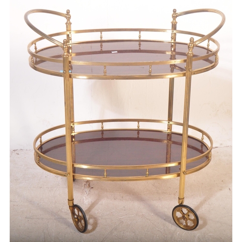 1177 - Mid-Century retro tubular gilded metal two tier butlers hostess serving trolley. Raised on oversized... 