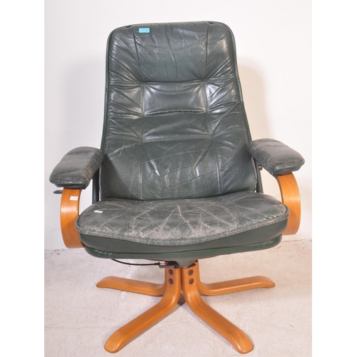 1178 - Retro 20th century green leather and bentwood swivel armchair. Raised on splayed leg base with bentw... 