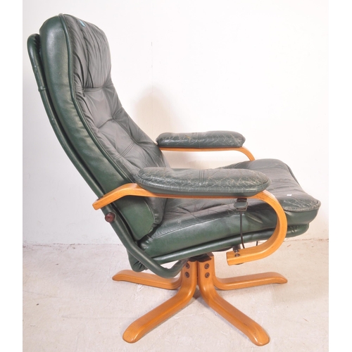 1178 - Retro 20th century green leather and bentwood swivel armchair. Raised on splayed leg base with bentw... 