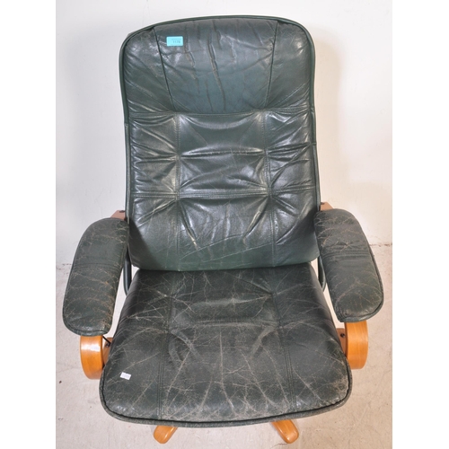 1178 - Retro 20th century green leather and bentwood swivel armchair. Raised on splayed leg base with bentw... 